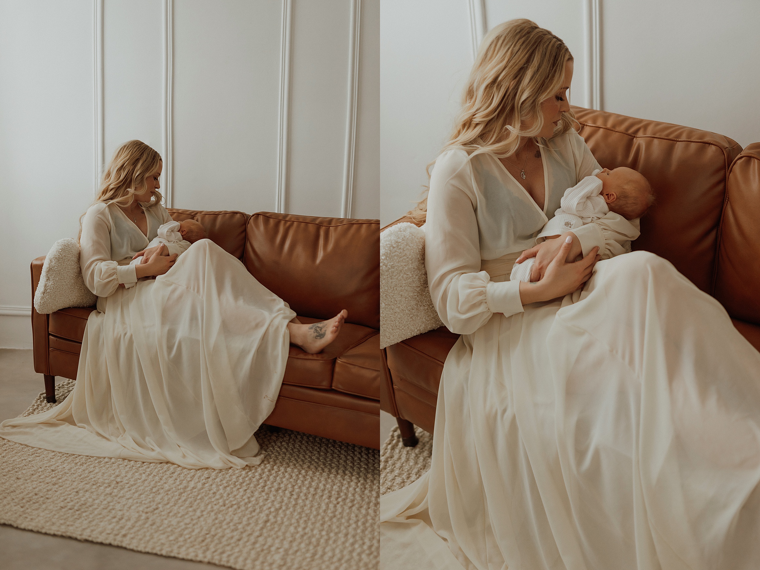 Mom sits on couch in long dress holding baby with Minneapolis Boudoir Photographer