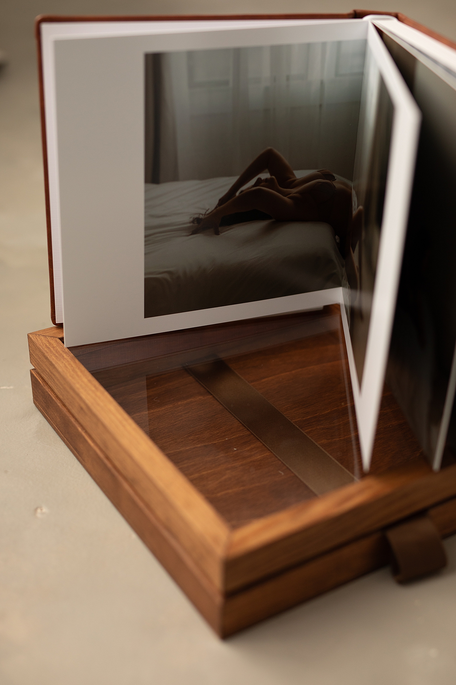 heirloom book set on glass box by Minneapolis photographer 