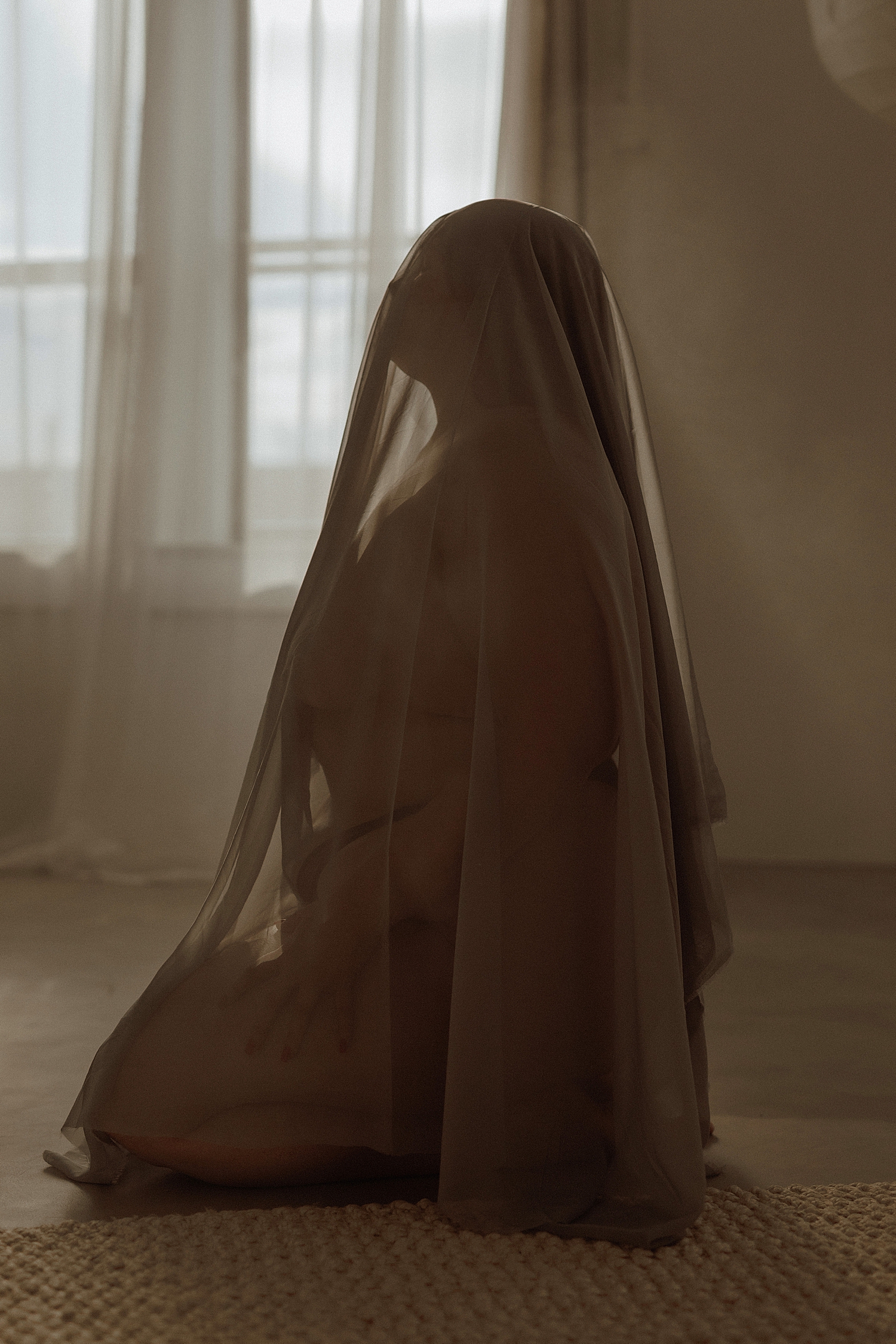model covers her head with full length veil by Mary Castillo Photography