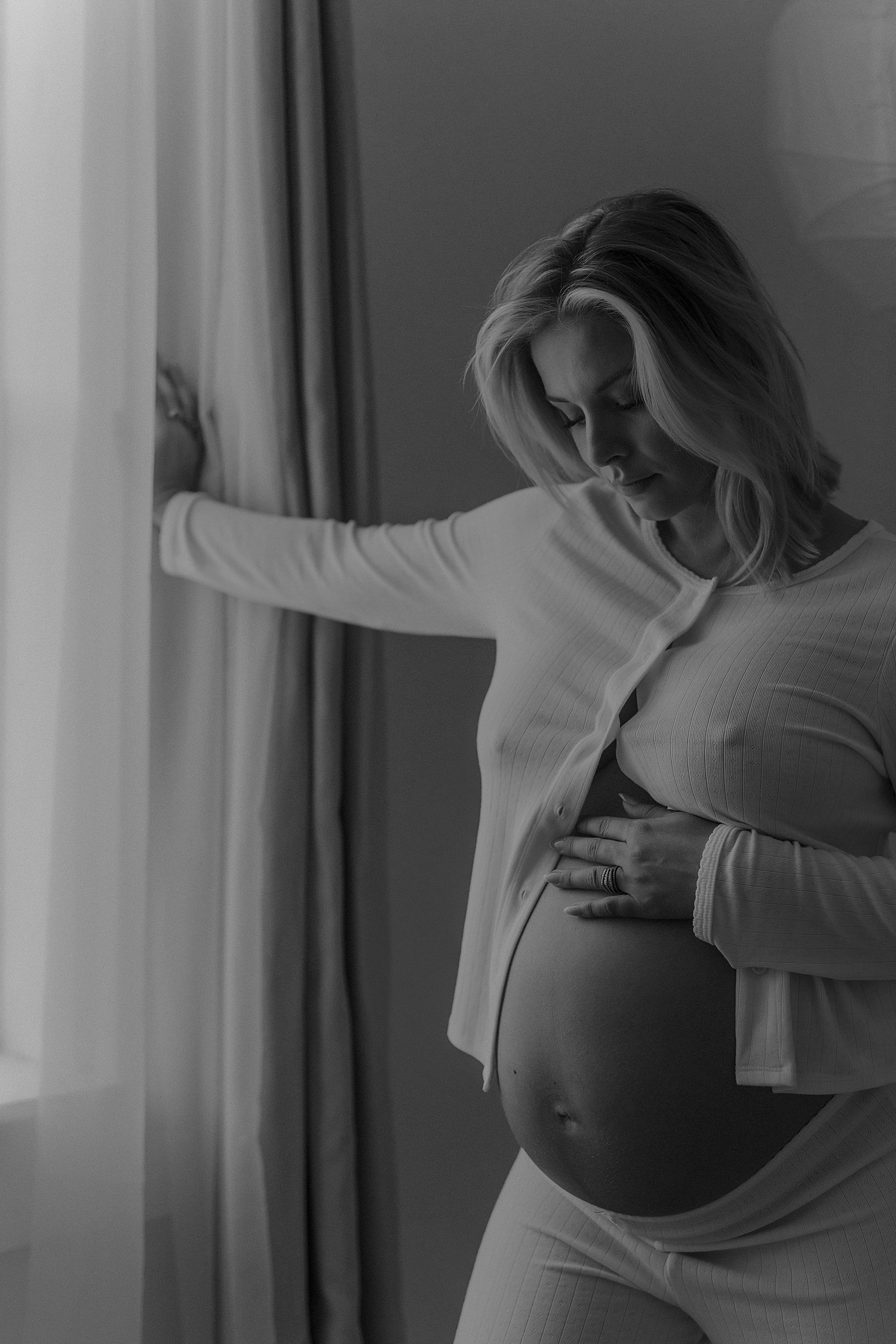 expecting mama in matching set by window shows off maternity shoot outfit inspiration 