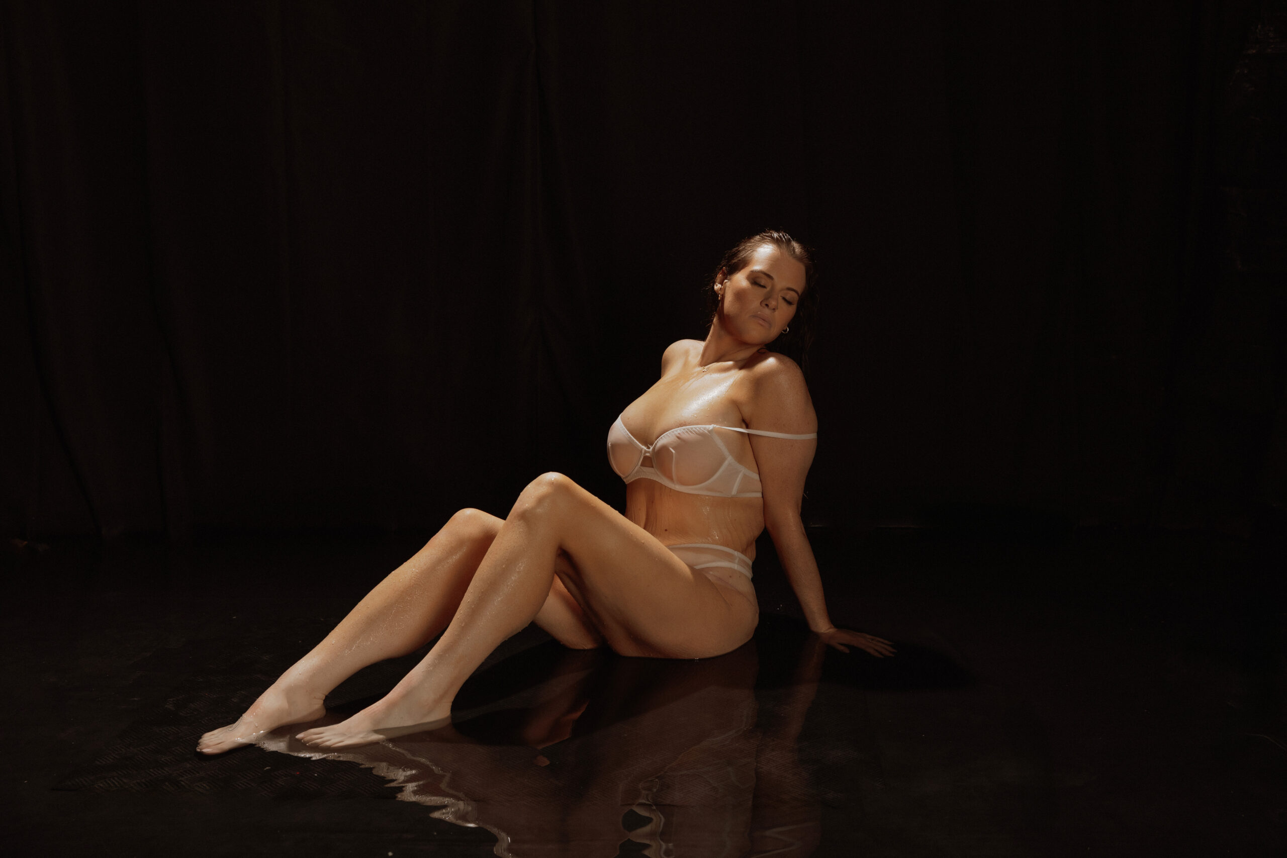 Woman sitting outstretched on floor by Mary Castillo Photography