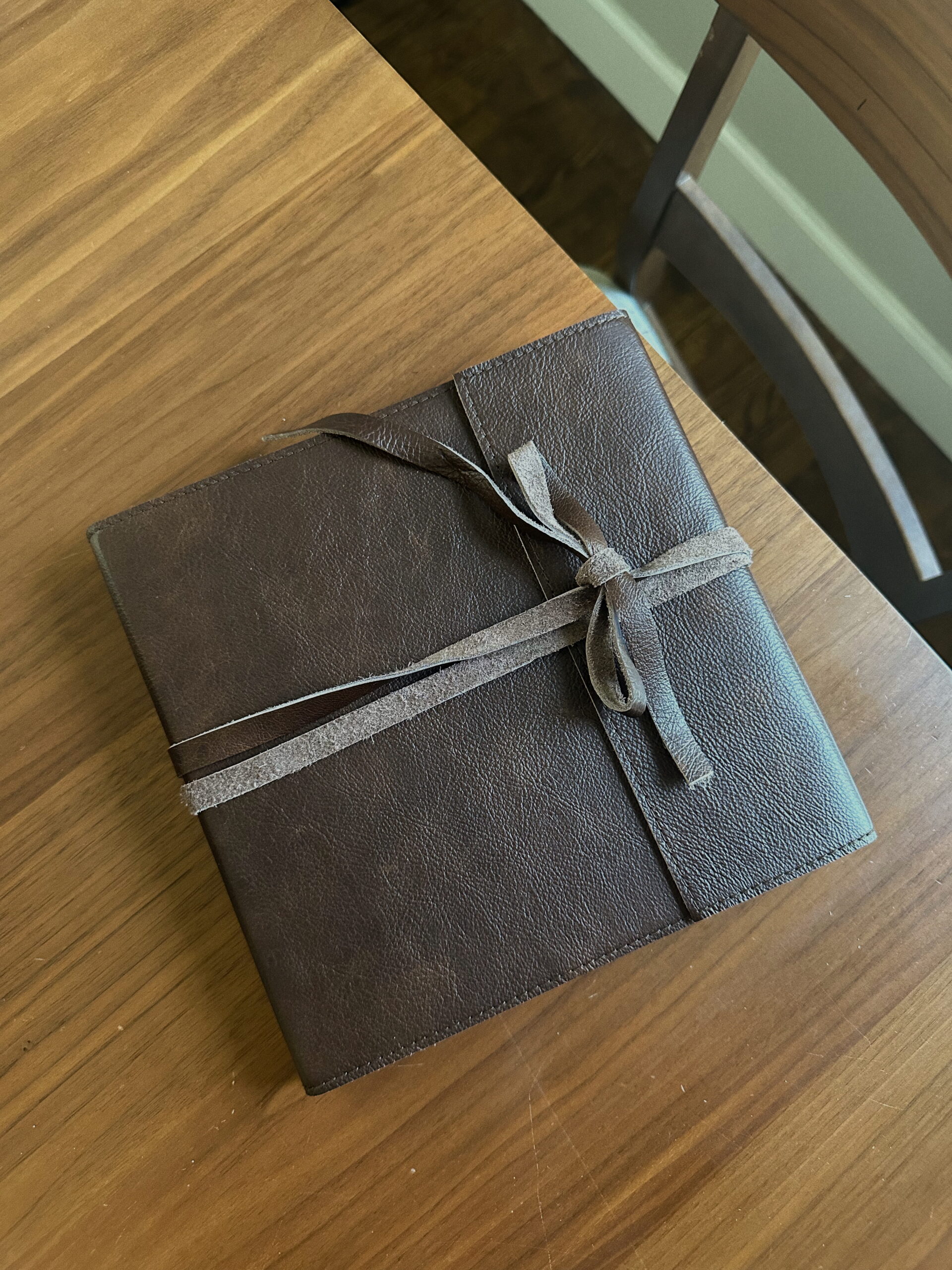 Minneapolis Boudoir Photographer captures wrapped leather journal-style album