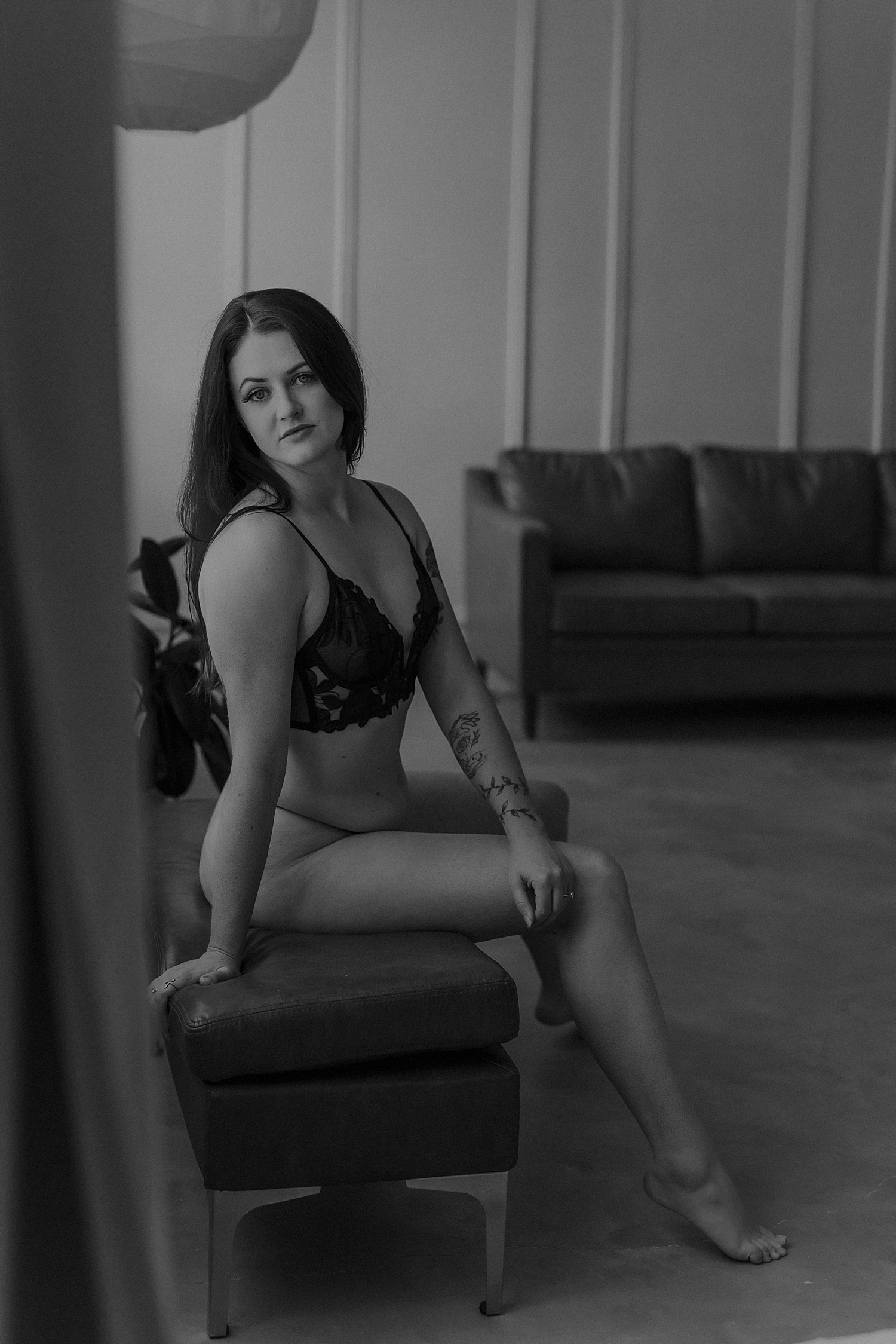 woman sits on bench in studio by Mary Castillo Photography